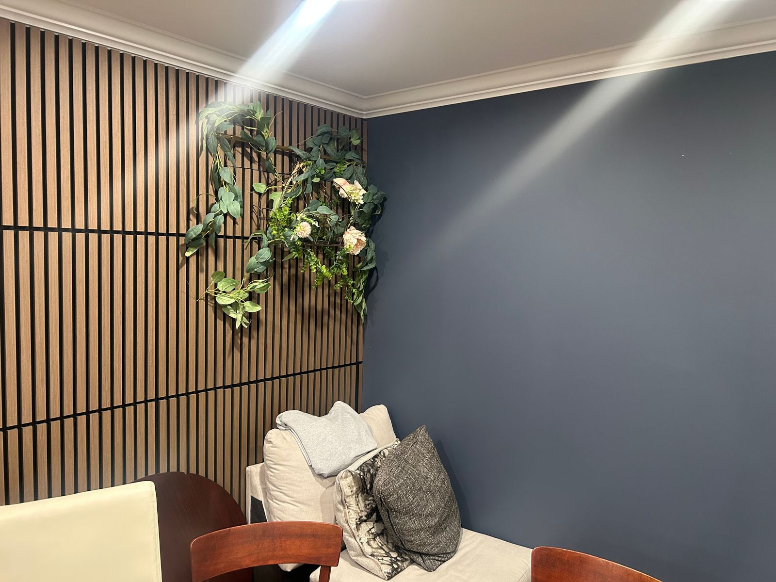 Accent wall with wood slat feature and floral decor