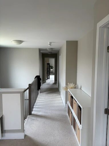 Upstairs hallway painted in soft neutral tones