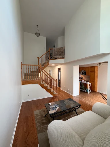 Living room and staircase painted in warm neutrals