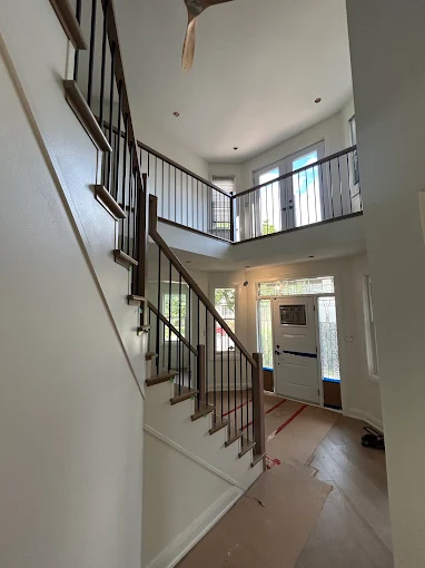 Newly painted entryway with staircase
